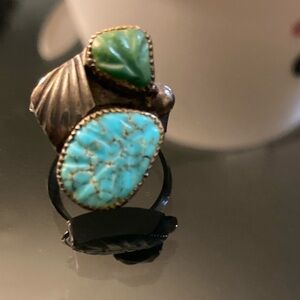 Authentic Native American “Zuni” blue and green turquoise ring made of silver.
